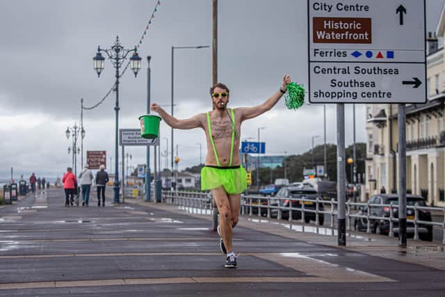 Ben Brooks completes his mile at South Parade Pier, Southsea.

Picture: Habibur Rahman