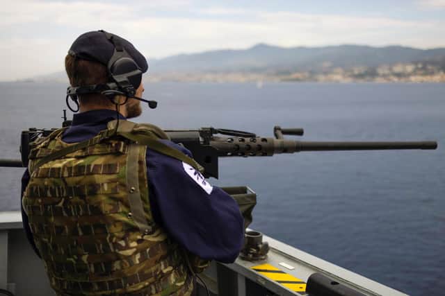 A sailor mans one of HMS Defenders machine guns as the ship sailed through the Messina Straits, a narrow body of water that separates the island of Sicily and Italy.
Credit: LPhot Dan Rosenbaum, HMS Defender