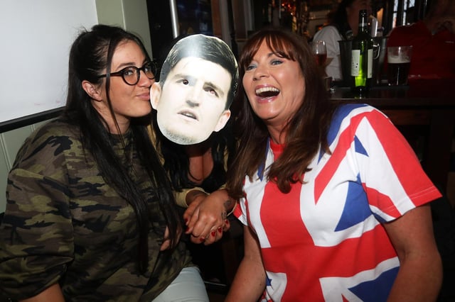 England fans pictured at the Milton Arms in Portsmouth, UK, about to watch England play on TV in the Semi-finals at Wembley. Pictured is from left, Chaz Mercer, Kate Davis and Karen Mercer-Wake. Picture: Sam Stephenson