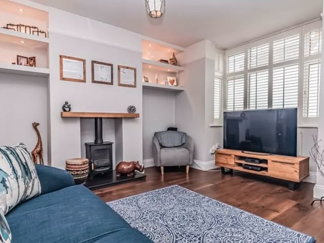 The listing says: "This excellently presented, extended end-of-terrace property has accommodation set over three inviting floors, with three bedrooms and a separate study room, making it an ideal family home."