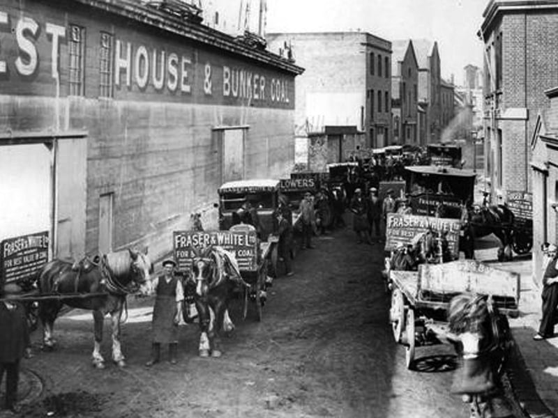 Coal wagons waiting to be loaded from the giant bunker in East Street, Old Portsmouth. Picture: Courtesy of Terry Piper