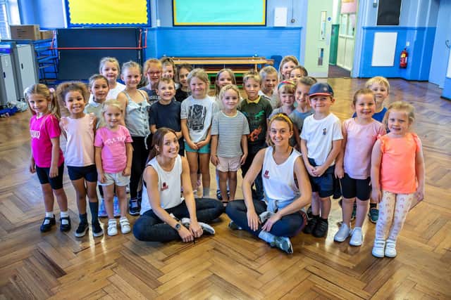 Samantha Miles and Beverley Norton from FunKidz with the dance class from College Park infant school. Picture: Mike Cooter