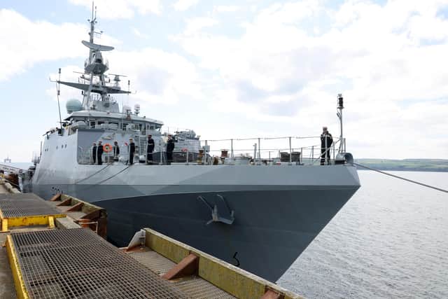 Image shows HMS Spey alongside Invergordon for her commissioning service.