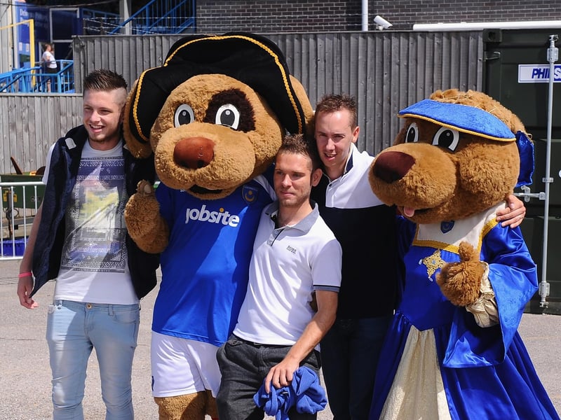 Pompey fans with the club mascots ahead of the League Two match against Oxford United at Fratton Park in August 2013. Photo by Mike Hewitt/Getty Images