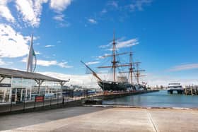 HMS Warrior alongside the Spinnaker Tower