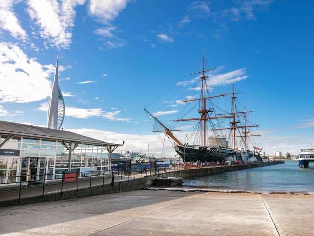 HMS Warrior alongside the Spinnaker Tower