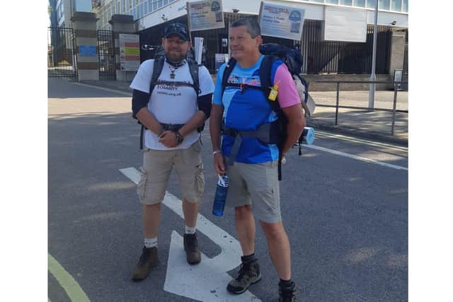Chief Petty Officer (Electronic Warfare) Chris Levy and his retired colleague Petty Officer (Electronic Warfare) Simon Cranfield set off from HMS Nelson for a 200-mile trek for Royal Navy and Royal Marines Charity and Bristol Children's Hospital. Pictured: Chris Levy and Simon Cranfield setting off