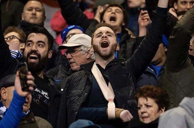 Christopher Proud, left, cheering on Pompey