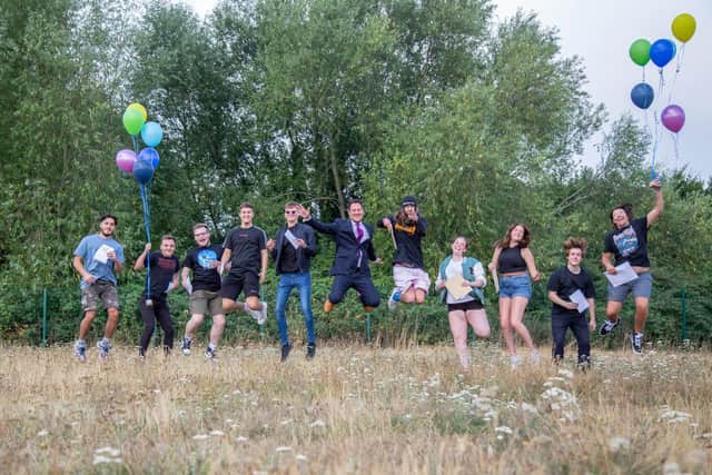 A-level results at Portsmouth College, Tangier Road, Portsmouth on Thursday
Pictured: Students and MP Stephen Morgan celebrate by jumping in the air at Portsmouth College.
Picture: Habibur Rahman