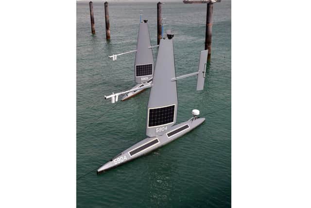 The new drones, which are powered by the sun and wind and look like sailboards, have been tested out in the Gulf by a team led by the Royal Navy