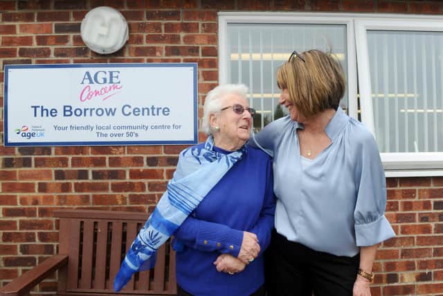 Eileen Gordon (95) from Cowplain, has been volunteering with Age Concern for the last 23 years. Pictured: Eileen with Liz Wood, centre manager, at Age Concern in Cowplain. Picture: Sarah Standing (280422-2809)