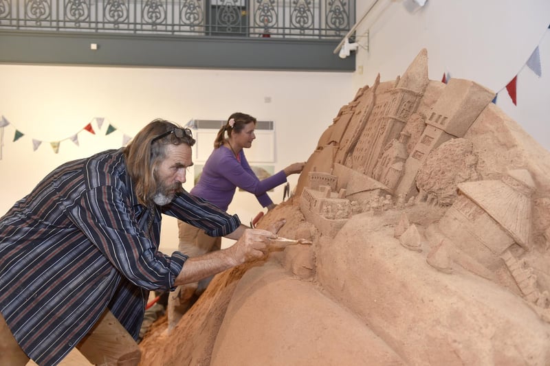 Pictured is: Sand artists Paul and Remy Hoggard.
Picture: Sarah Standing (280723-7212)