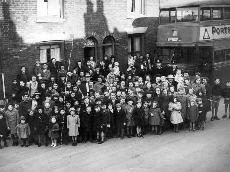 Residents gather in Buckland, Portsmouth, around 1947 with 'Bunky Doo-dalee-do' starring on accordion, real name Alfred Nicholson. The image was taken in 1945 in Sultan Road. Picture: Courtesy of Brian Duke