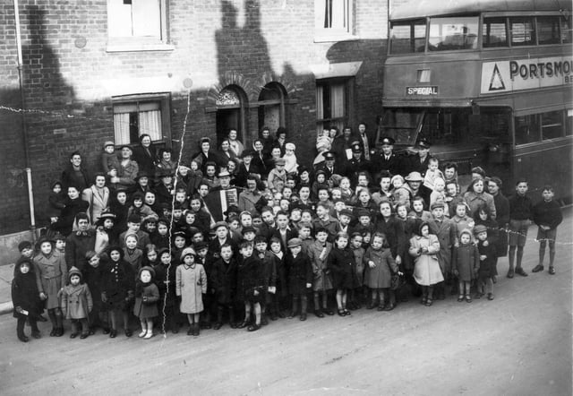 Residents gather in Buckland, Portsmouth, around 1947 with 'Bunky Doo-dalee-do' starring on accordion, real name Alfred Nicholson. The image was taken in 1945 in Sultan Road. Picture: Courtesy of Brian Duke
