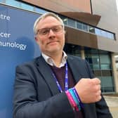 Professor Gareth Griffiths director of the Cancer Research UK Southampton Clinical Trials Unit wearing a World Cancer Day bracelet