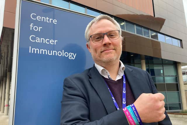 Professor Gareth Griffiths director of the Cancer Research UK Southampton Clinical Trials Unit wearing a World Cancer Day bracelet