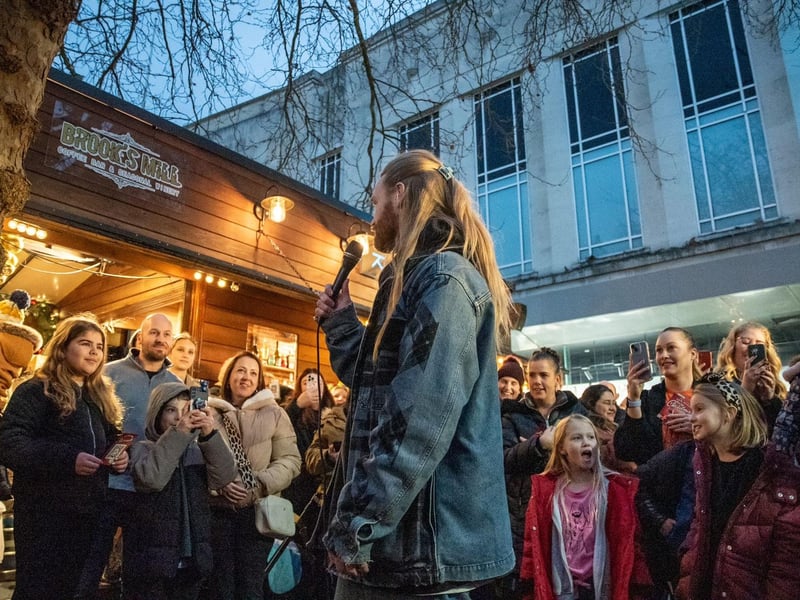 Sam Ryder addresses the crowd in Commercial Road, Portsmouth before singing a live version of his Christmas single, You're Christmas to Me.