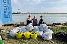 Final Straw Foundation members Georgie Smith, Zoe Bentley, and Zoe's son Matt at Eastney beach on October 9, 2021
