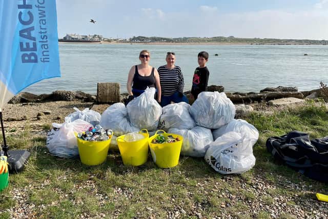 Final Straw Foundation members Georgie Smith, Zoe Bentley, and Zoe's son Matt at Eastney beach on October 9, 2021