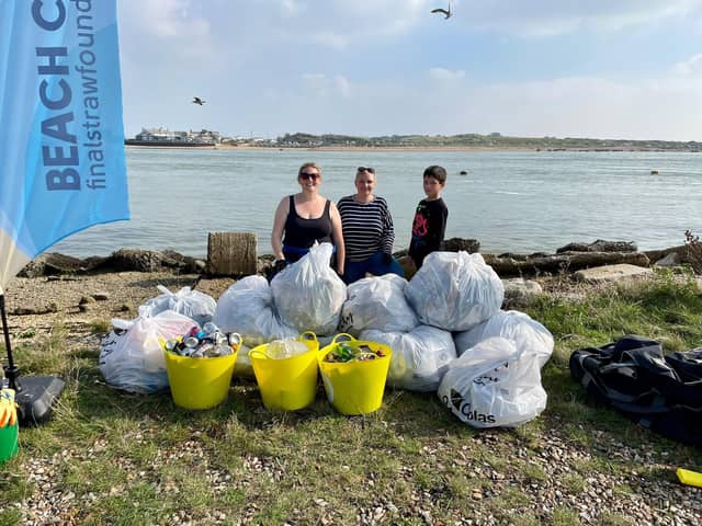 Final Straw Foundation members Georgie Smith, Zoe Bentley, and Zoe's son Matt at Eastney beach on October 9, 2021