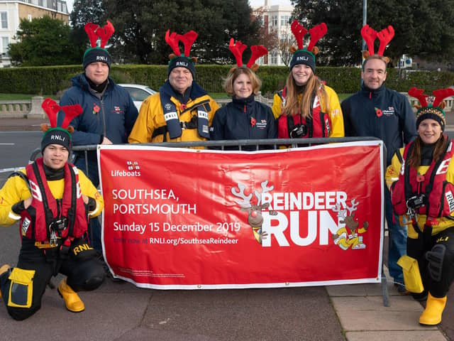 Pictured is: Portsmouth RNLI volunteers stand in for Parkrun volunteers to promote their Reindeer run back in 2019. 

Picture: Keith Woodland (091119-19)