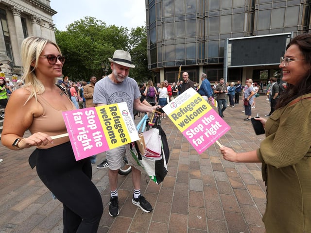 Placards are handed out. Unity Rally, Guildhall Square, Portsmouth
Picture: Chris Moorhouse (100824-04)
