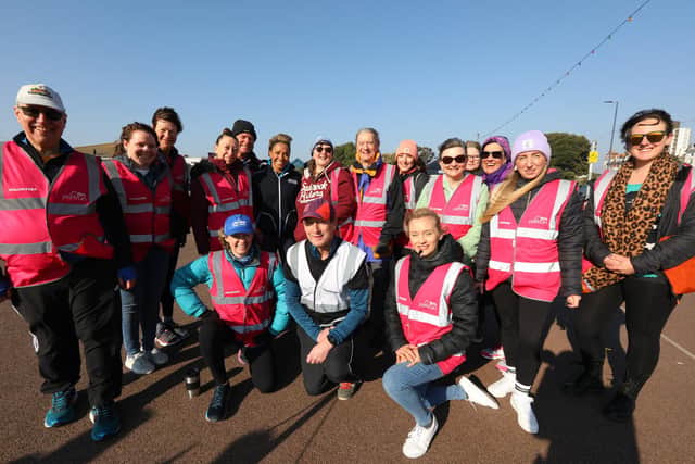Dame Kelly, standing sixth from left, with run director Chris Kenyon, in white bib, and other volunteers. Southsea parkrun with Olympic gold medallist Dame Kelly Holmes, who was working on behalf of new parkrun sponsor De'LonghiPicture: Chris Moorhouse (jpns 190322-13)