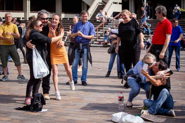 Pictured: Piers Corbyn encouraging protesters to hug each other at the event.
Picture: Habibur Rahman