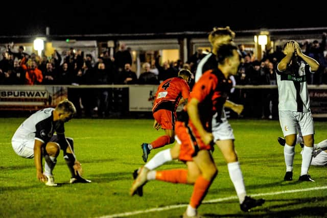 -Jake Raine wheels away after his stoppage time winner, while Bemerton defenders are left stunned. Picture by Daniel Haswelll