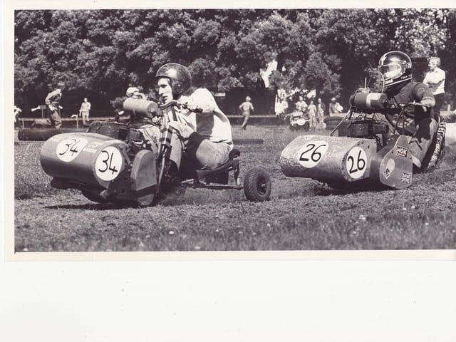 Lawnmower drivers race against each other during the Portsmouth Lawnmower Grand Prix, held at St James Hospital, Milton on July 27 1980. The News PP3706