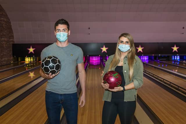 Laura Crawford (25) brought Henry Weaver (28) down from London for the day to visit her old University town, starting at Hollywood Bowl in Gunwharf Quays. Picture: Mike Cooter (170521)
