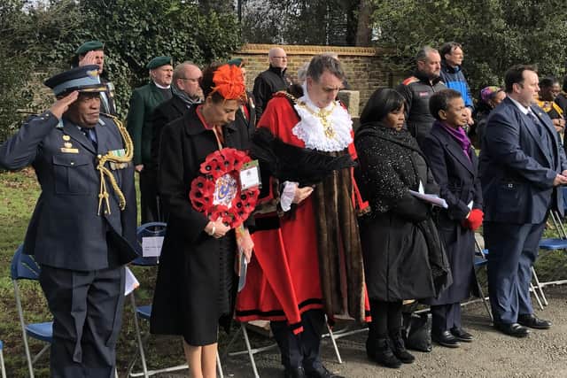 Crowds of invited officials stand during the one minute silence at Milton Cemetery honouring the victims of the SS Mendi tragedy. Photo: Tom Cotterill