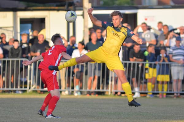 Moneyfields' Joe Briggs, right, during his side's opening game of 2022/23 at Horndean - a further seven away games have followed, and five more arrive in the next few weeks. Picture by Martyn White