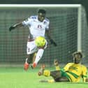 Dan Ajakaiye (white shirt) in action for Hastings