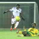 Dan Ajakaiye (white shirt) in action for Hastings