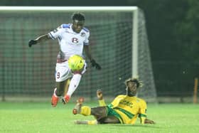 Dan Ajakaiye (white shirt) in action for Hastings