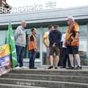 Members of the Rail, Maritime and Transport union (RMT) on the picket line outside Basingstoke train station today Picture: Andrew Matthews/PA Wire