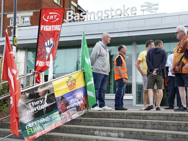 Members of the Rail, Maritime and Transport union (RMT) on the picket line outside Basingstoke train station today Picture: Andrew Matthews/PA Wire