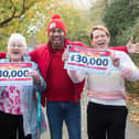 Marion McSherry-Rhoades (left) with Diane Cuthbert of Waterlooville celebrate winning a share of £120,000 in the People's Postcode Lottery. They are joined by the lottery's ambassador Danyl Johnson