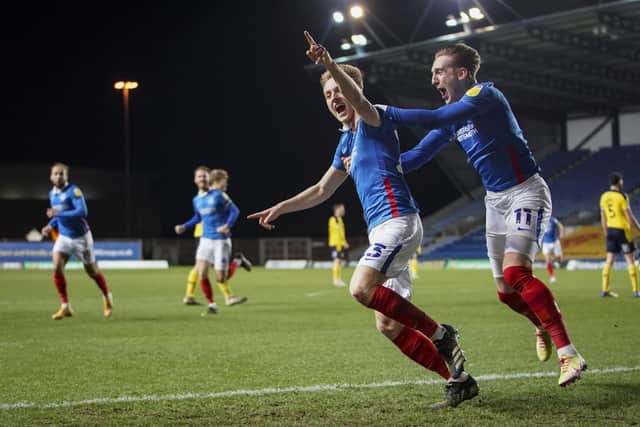 Harvey White celebrates with Ronan Curtis after netting what proved to be the winner against Oxford United on Tuesday night. Picture: Jason Brown/ProSportsImages
