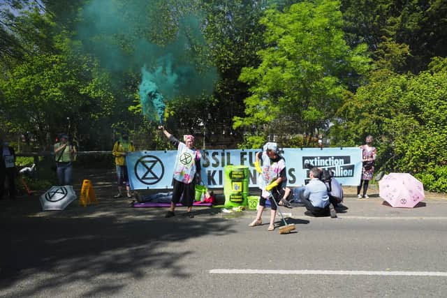 Handout photo issued by Extinction Rebellion of activists locking down BP's Southampton oil terminal highlighting Government and fossil fuel industry "greenwash" policies. Issue date: Tuesday June 1, 2021. PA Photo: William Templeton/PA Wire