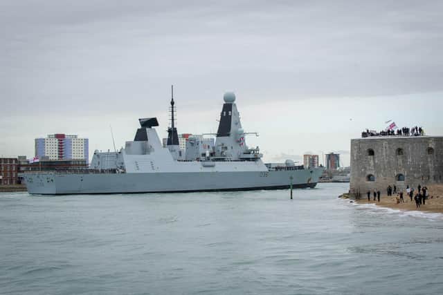 HMS Defender passes the Round Tower as she returns to Portsmouth.
Picture: Habibur Rahman