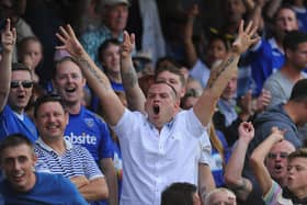 Pompey fans celebrate a goal against Oxford United at Fratton Park in August 2013. Photo by Mike Hewitt/Getty Images