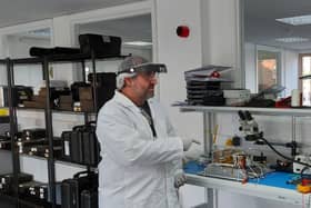 Engineers working on the satellite at In-Space