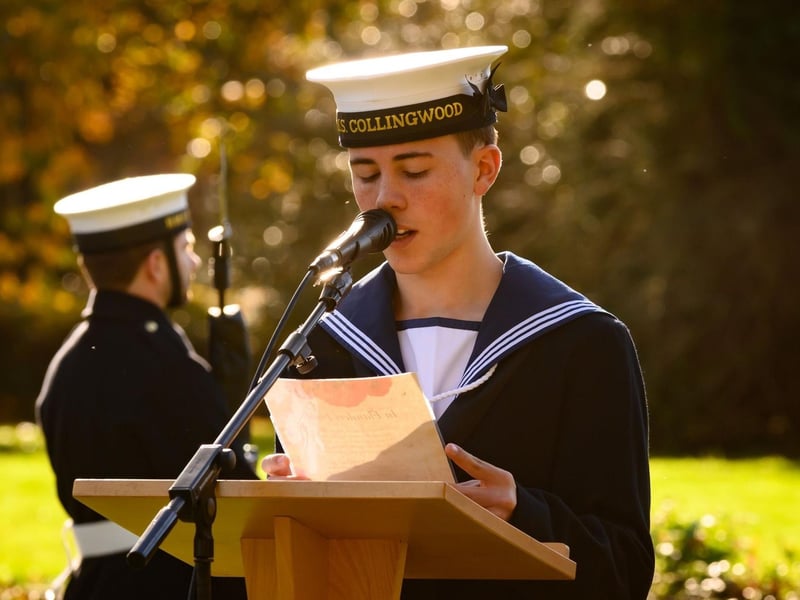 AB John McCrae, youngest Collingwood sailor, reading “In Flanders Fields”.