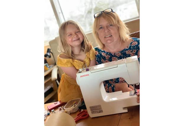 Lin Gell from Gosport set up a group of around 130 sewers who are working hard to create scrubs for medical staff across the area. Pictured here with five-year-old great-granddaughter Darcy