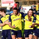 Matt Briggs, second left, celebrates his late Gosport winner at Merthyr. Picture by Tom Phillips