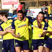 Matt Briggs, second left, celebrates his late Gosport winner at Merthyr. Picture by Tom Phillips