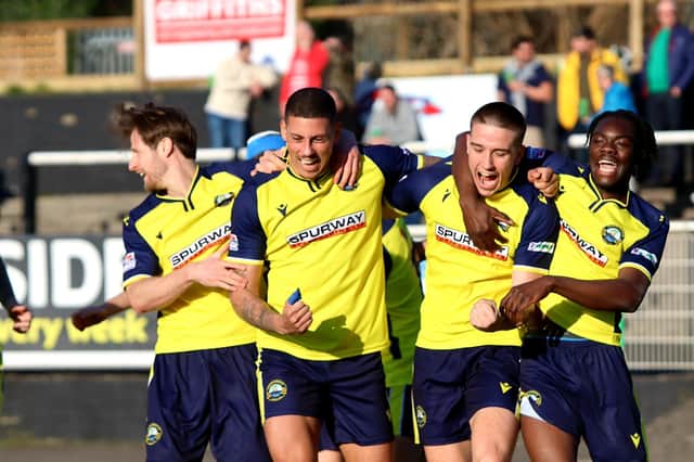 Matt Briggs, second left, celebrates his late Gosport winner at Merthyr. Picture by Tom Phillips