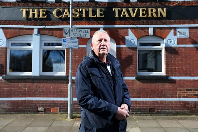 Publican John Molloy at the Castle Tavern, Somers Road, Southsea. He lives in the flat upstairs and said he's scared of the anti-social behaviour going on at the adjacent Traveller's Rest pub - left derelict and abandoned. Picture: Chris Moorhouse (jpns 120423-13)